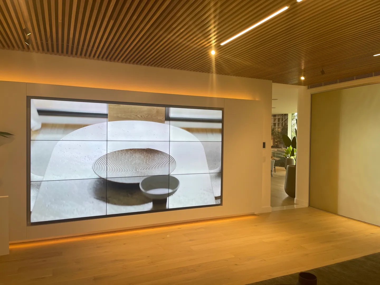 video A large screen tv in the middle of a room.